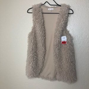 Blush pink faux fur sweater vest.